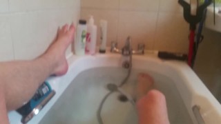 Teen in the bath showing off his skinny legs and cock