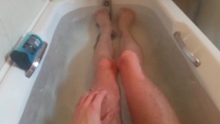 Teen in the bath showing off his skinny legs and cock