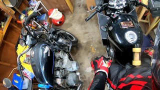 Leather biker milked on his motorcycle