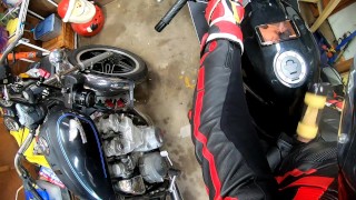Leather biker milked on his motorcycle