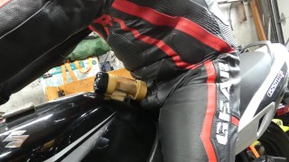Leather biker milked on his motorcycle