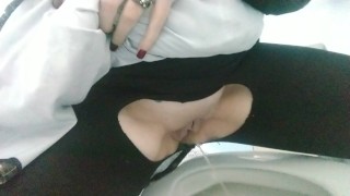 Pissing in a public bathroom
