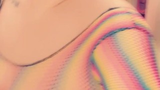 Round ass Curvy Latina feeling sexy in rainbow fishnet top and thong