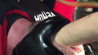Playing with inflatable dildo in full boxing gear