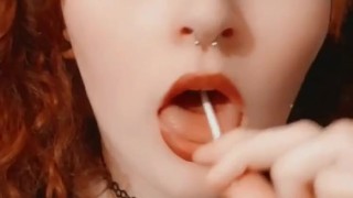 Redhead tease with a sucker 