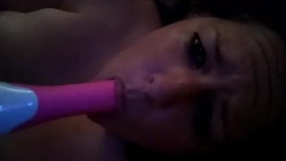 Horny slut deep throats her vibrator
