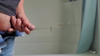Squeezing my cock while pissing