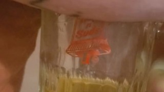 Bbw encouraged to pee more into glass