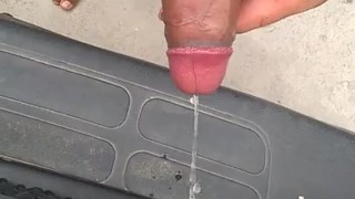 Pissing and jerk off in public in front of a car