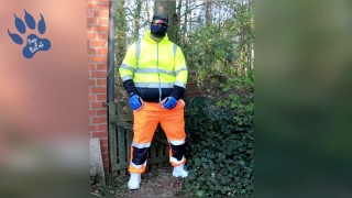 quick pawing off in hi-vis tracksuit and sneakers outdoors