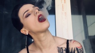 hot girl in red lipstick smoke on the balcony only in bra