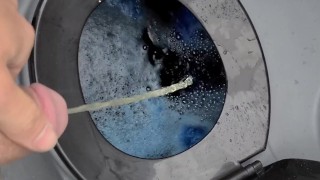 Taking a piss in the portapotty
