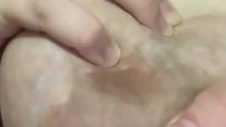 Hand expressing my breastmilk 