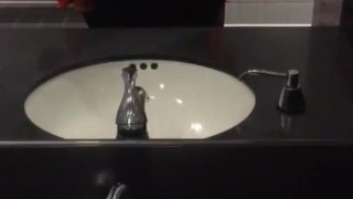 Busty teen plays with boobs at work