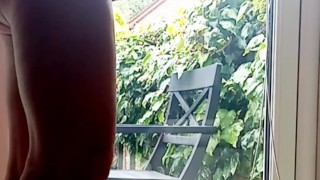 Naked wank with ball stretcher in window 