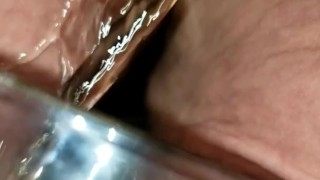 BBW Mistress pisses into glass. While her pet holds the glass.