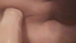 Riding 7 inch dildo on the bed