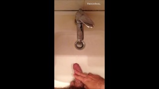 Peeing into wash basin in  restroom