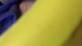 Cougar stuffs curved ripe yellow banana in her wet cunt and asshole