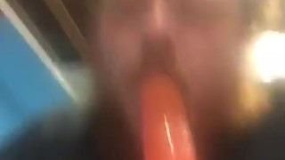 Fat guy sucking on dildo