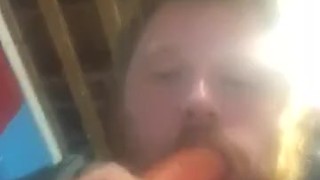 Fat guy sucking on dildo