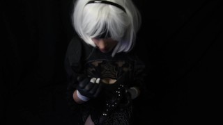 Silicone doll with 2B cosplay gives blowjob to strapon