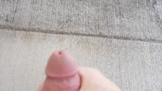 Risky cumshot in public park