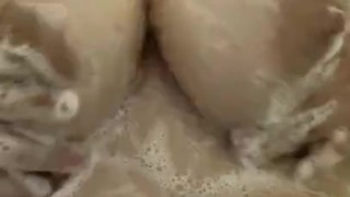 Sexy pink haired bitch takes shower can’t stop washing her filthy tits 