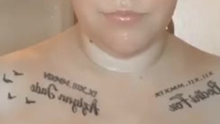 Sexy blonde babe with huge tits, playing with them in hot shower