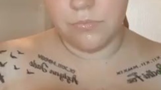Sexy blonde babe with huge tits, playing with them in hot shower
