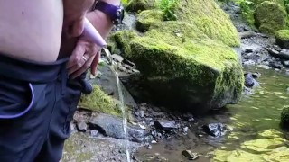 Pissing with my go girl into the river