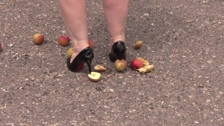 Crush fetish outdoors Fat legs in high heel shoes crush apples