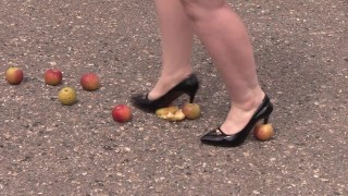 Crush fetish outdoors Fat legs in high heel shoes crush apples