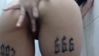 Latina masturbating in the gym shower