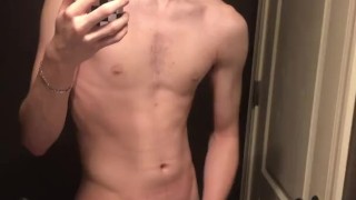 19 year old college guy wearing glasses jerks of in the mirror