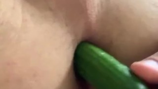 Twink plays with cucumbers 