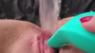 Clit vibrator makes amateur squirt puddle in bed