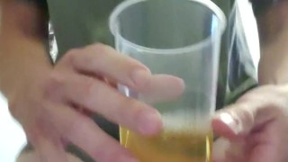 Sissy drinking own piss from cup.