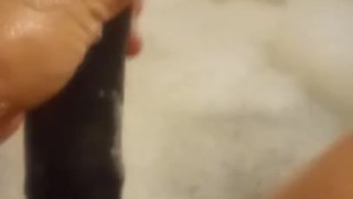 Black dildo bathtub playtime