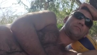 Relaxing in the shade on the beach.