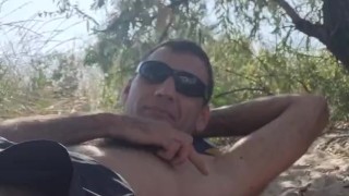 Relaxing in the shade on the beach.