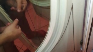 Hairy uncut guy jerks off to mirror with lots of dicks
