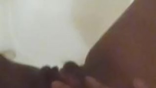Black slut pisses in the shower