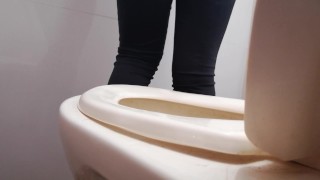 I film my friend peeing standing in my bathroom. 