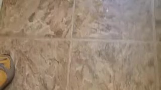 Power piss on bathroom wall