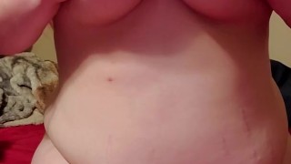 Redhead playing with tits