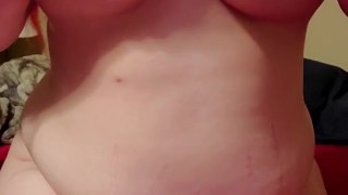 Redhead playing with tits