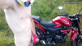 Motorcycle handjob in mxhelmet and Nike sneakers