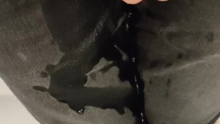 Pissing Black shorts and Sneakers
