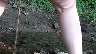 pissing in the forest
